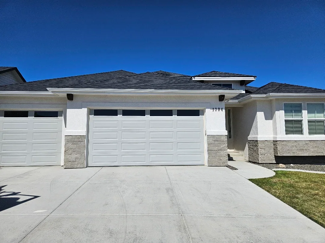 Modern home with new seamless gutters and architectural shingles